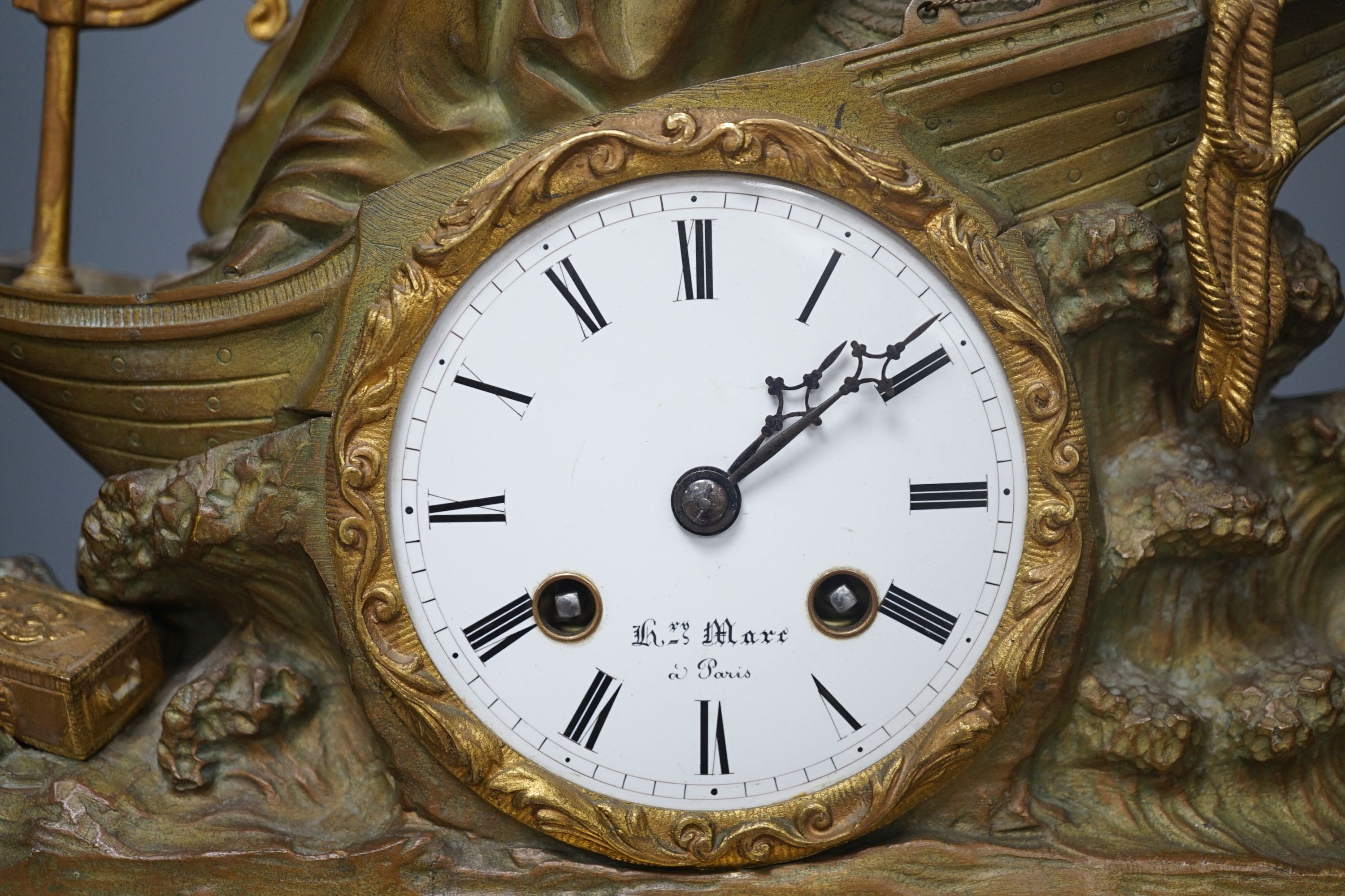 A 19th century French bronze and ormolu mounted black marble mantel clock, 48cms high.